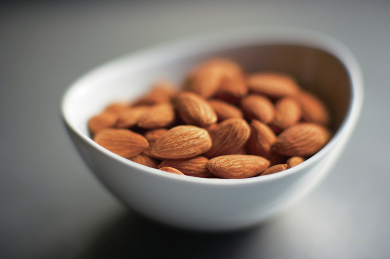 White bowl of almonds